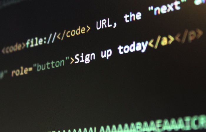 Detailed view of HTML and CSS code on a computer screen, concept of programming.